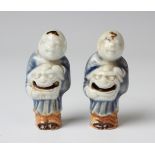 Two rare Japanese Hirado porcelain netsuke rattles, Edo period, each modelled as a Chinese boy