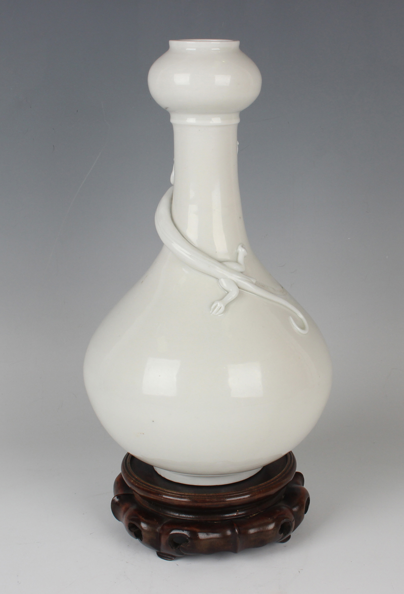 A Chinese blanc-de-Chine porcelain 'chilong' bottle vase, Qing dynasty, the low-bellied body beneath - Image 10 of 11