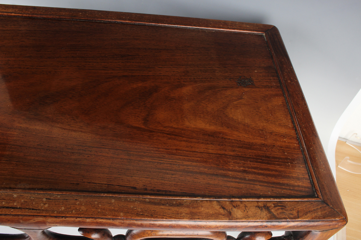 A Chinese hardwood low table, early 20th century, the rectangular panelled top above a carved and - Image 17 of 18