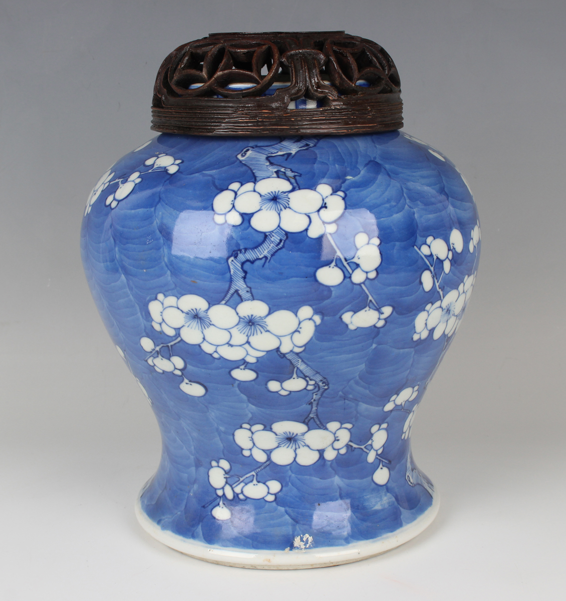 A Chinese blue and white porcelain jar, late Qing dynasty, of baluster form, painted with branches