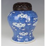 A Chinese blue and white porcelain jar, late Qing dynasty, of baluster form, painted with branches