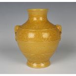 A Chinese yellow enamelled biscuit porcelain vase, mark of Qianlong but 20th century or later, of hu