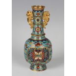 A Chinese cloisonné bottle vase, mark of Qianlong but later, the body, foot and narrow neck