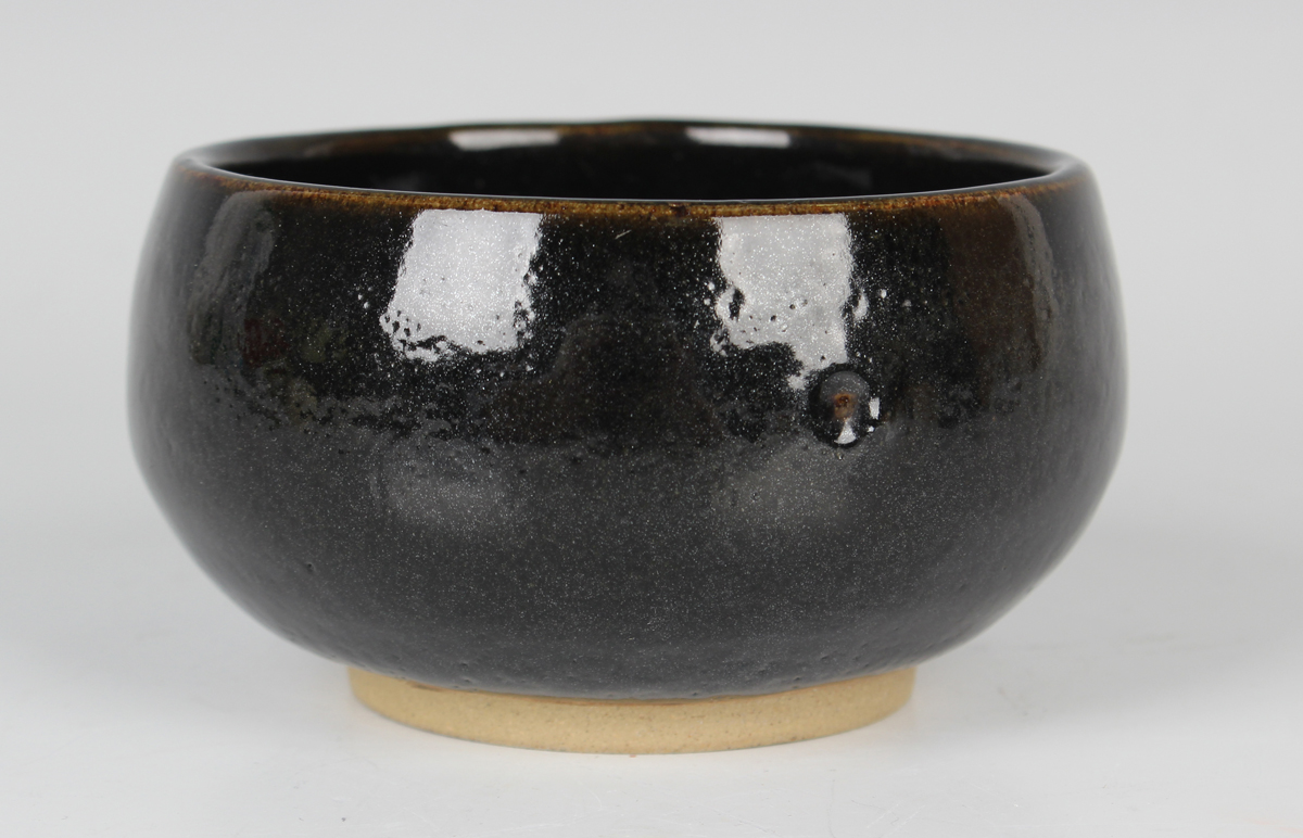 A Chinese dark brown glazed stoneware bowl, Song dynasty style but later, the interior with 'oil- - Image 3 of 4