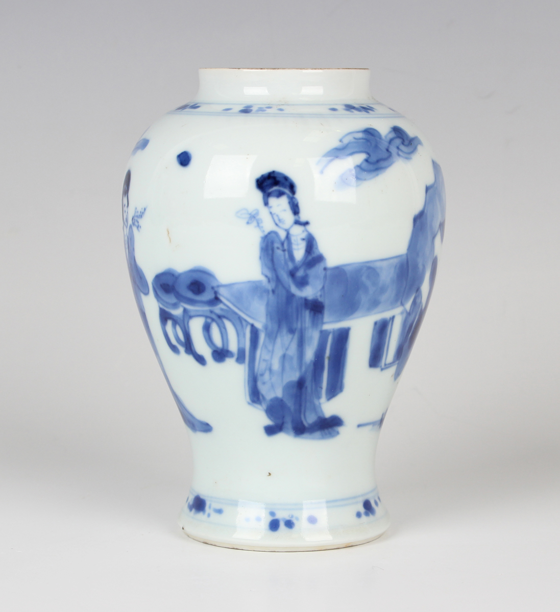 A Chinese blue and white porcelain vase, Kangxi period, of baluster form, painted with three maidens