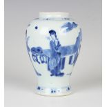 A Chinese blue and white porcelain vase, Kangxi period, of baluster form, painted with three maidens