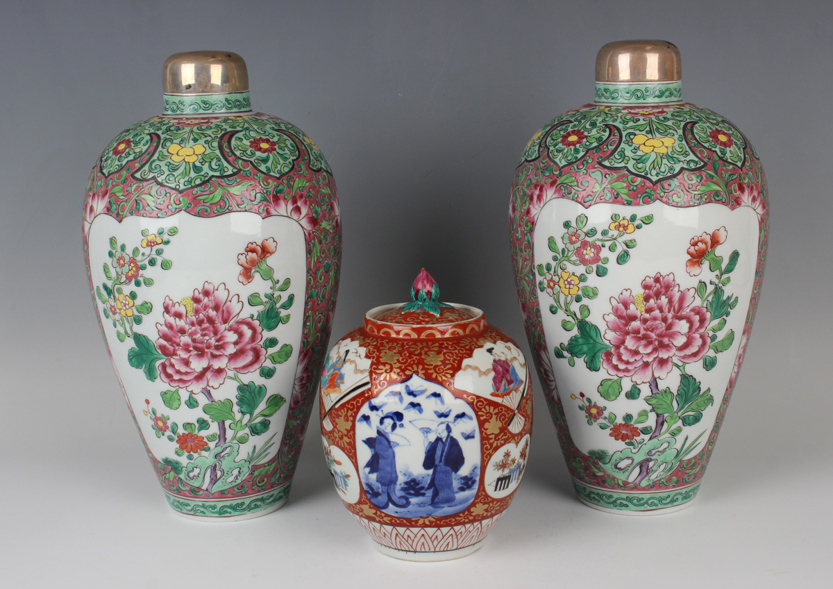 A Japanese Imari porcelain jar and cover, Meiji period, of ovoid form, painted with various panels