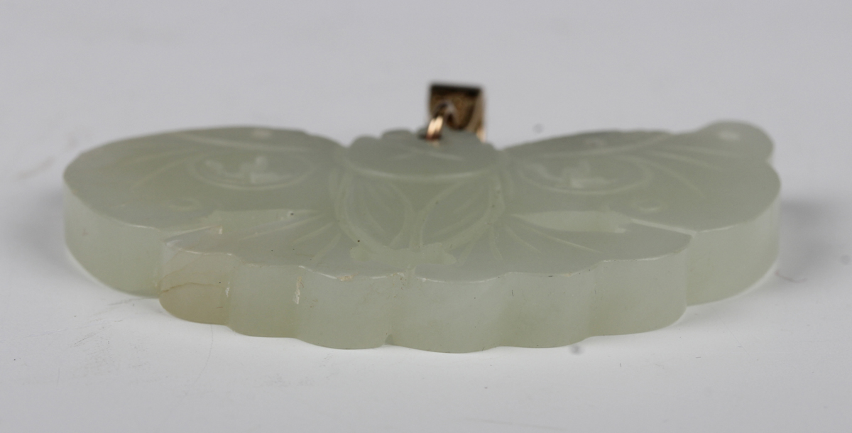 A Chinese pale celadon jade pendant, probably 20th century, carved and pierced in the form of a - Image 7 of 8