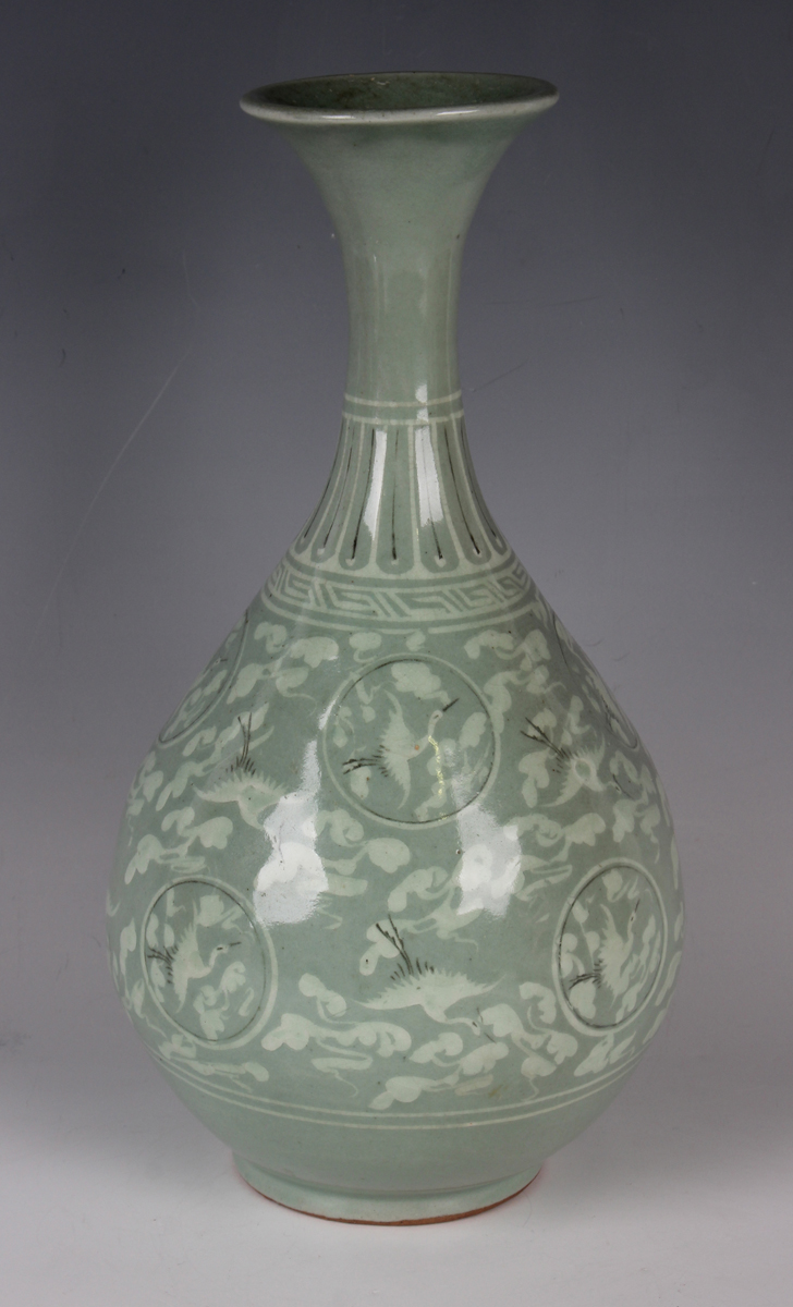 A Korean inlaid celadon vase, probably late Joseon dynasty, the pear shaped body decorated with