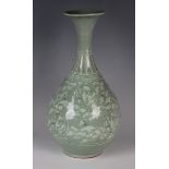 A Korean inlaid celadon vase, probably late Joseon dynasty, the pear shaped body decorated with