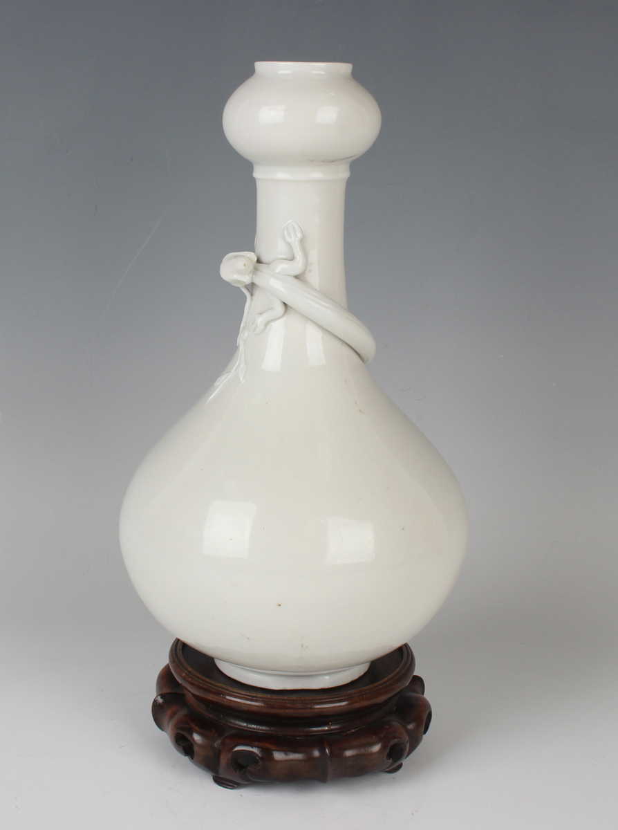 A Chinese blanc-de-Chine porcelain 'chilong' bottle vase, Qing dynasty, the low-bellied body beneath - Image 11 of 11