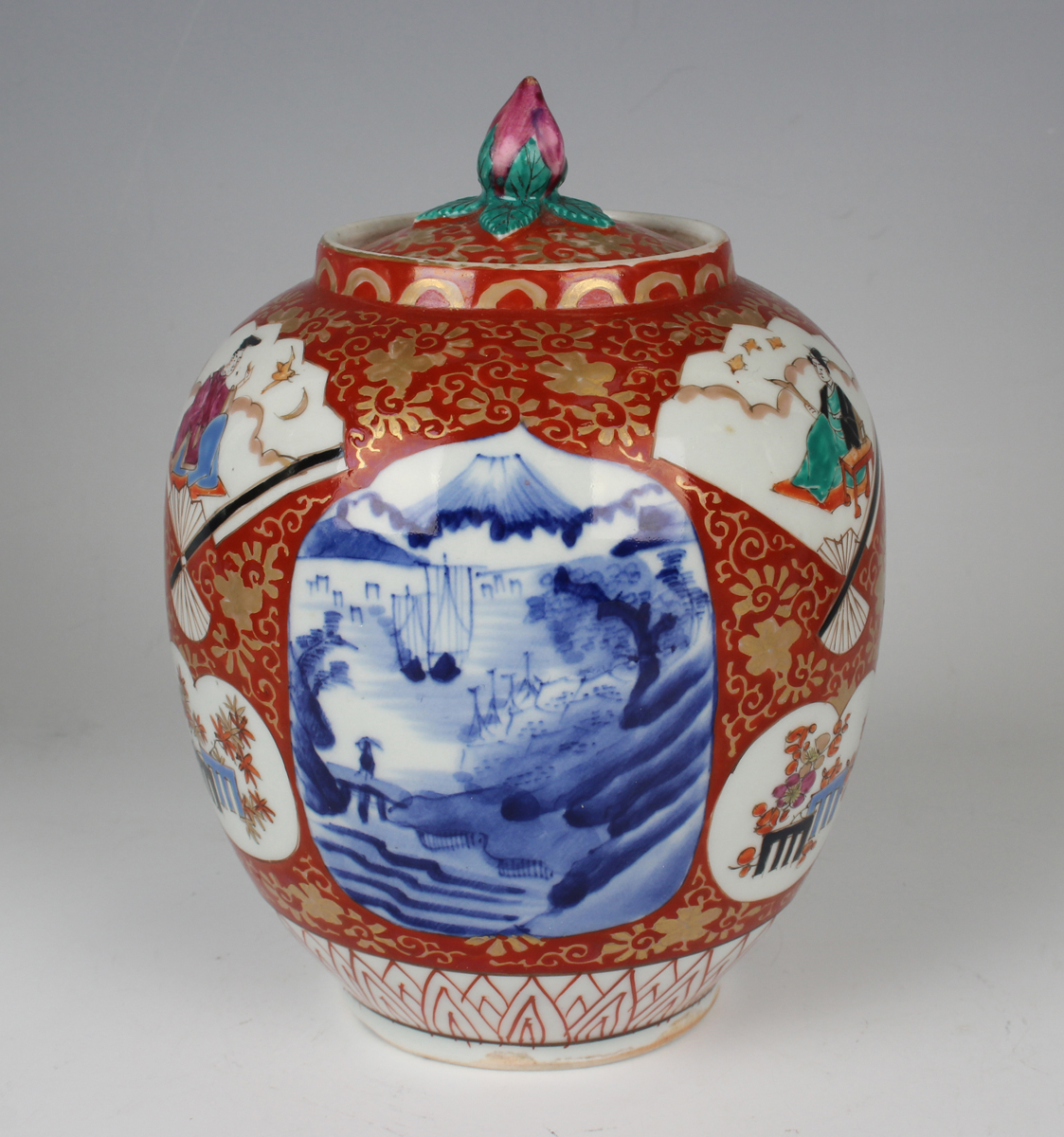 A Japanese Imari porcelain jar and cover, Meiji period, of ovoid form, painted with various panels - Image 20 of 22