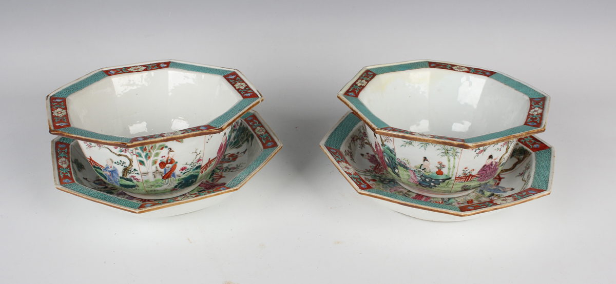 A pair of Chinese famille rose porcelain octagonal bowls and stands, 19th century, each facet