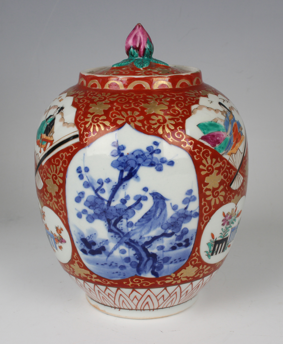 A Japanese Imari porcelain jar and cover, Meiji period, of ovoid form, painted with various panels - Image 18 of 22