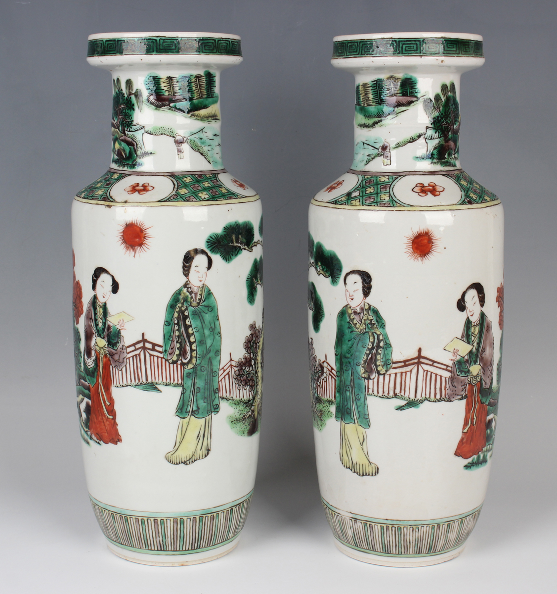 A pair of Chinese famille verte porcelain rouleau vases, late Qing dynasty, each painted with two