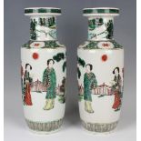 A pair of Chinese famille verte porcelain rouleau vases, late Qing dynasty, each painted with two