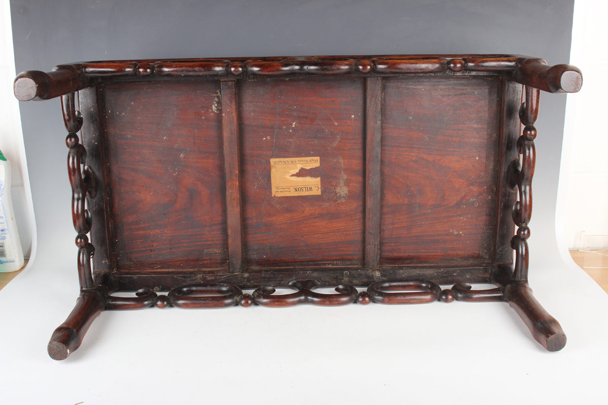 A Chinese hardwood low table, early 20th century, the rectangular panelled top above a carved and - Image 5 of 18