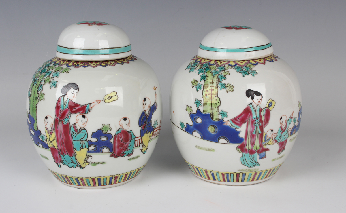 A pair of Chinese famille rose porcelain ginger jars and covers, 20th century, each painted with