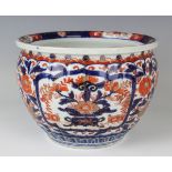 A Japanese Imari porcelain jardinière, Meiji period, of lobed circular form, painted and gilt with