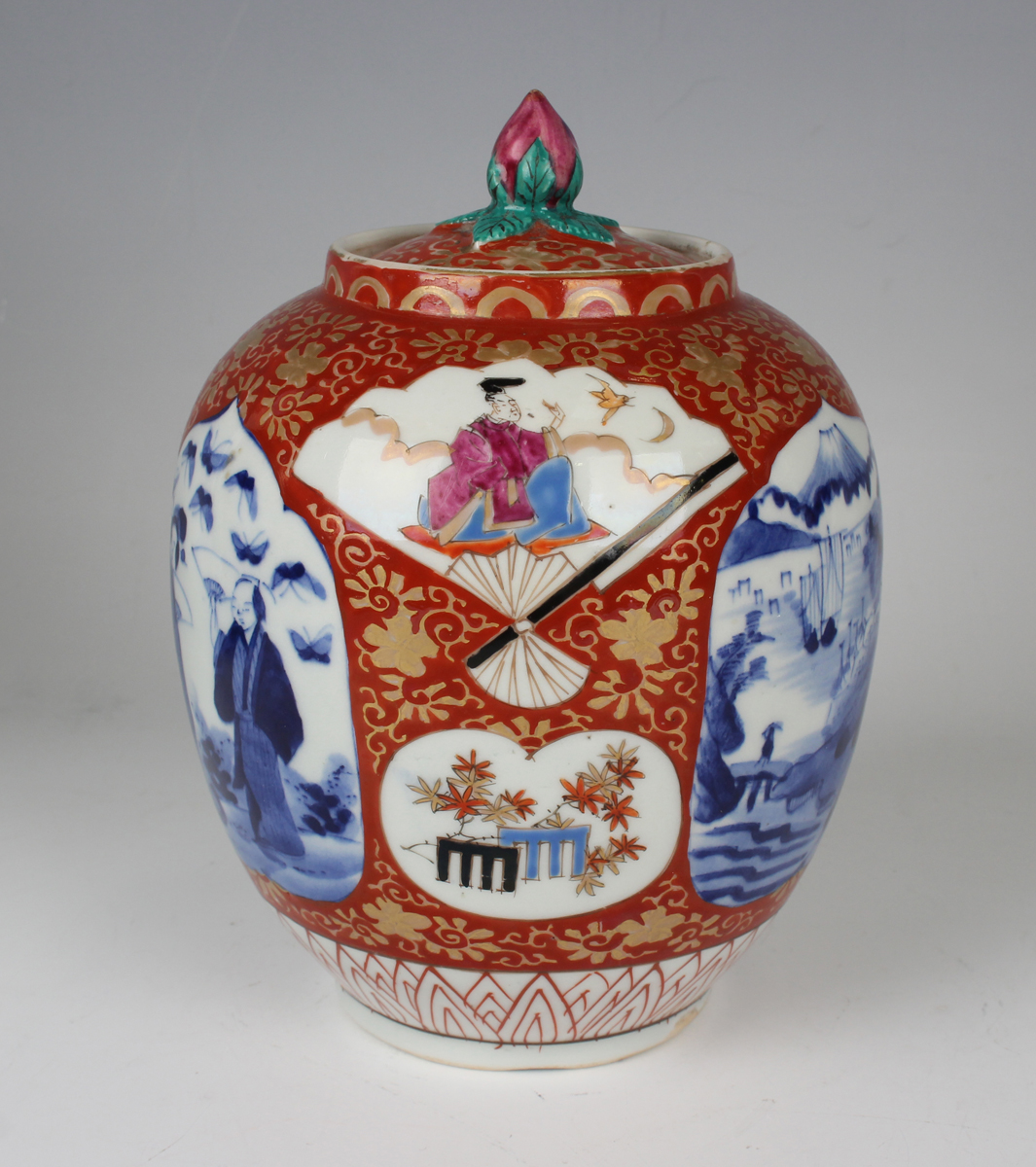 A Japanese Imari porcelain jar and cover, Meiji period, of ovoid form, painted with various panels - Image 21 of 22