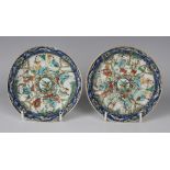 A pair of Chinese porcelain saucers, late Qing dynasty, each painted with segmented famille verte