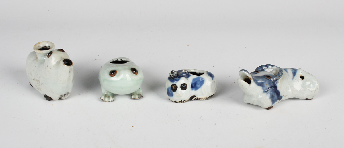 A group of four Chinese porcelain zoomorphic water droppers, Qing dynasty, including a blue and