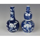 A Chinese blue and white porcelain bottle vase, mark of Kangxi but late 19th/early 20th century,