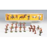 A Crescent Toys lead figure set of cowboys, boxed, together with two further cowboys, a rodeo