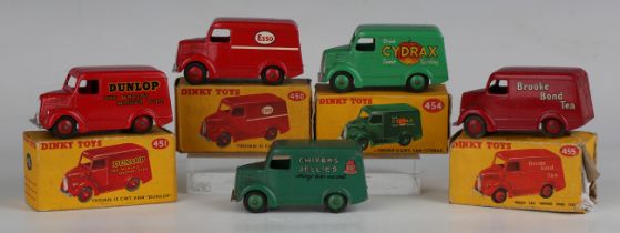 Five Dinky Toys Trojan vans, comprising No. 450 'Esso', No. 451 'Dunlop', No. 454 'Cydrax', No.