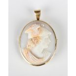 A gold mounted oval shell cameo pendant brooch, circa 1900, carved as Hermes, unmarked, weight 6.3g,