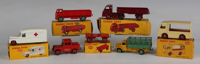 Seven Dinky Toys, comprising No. 420 forward control lorry, red with green wheels, No. 253 Daimler