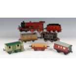 A Hornby Series gauge O clockwork 4-4-0 locomotive 1199 and tender, refinished in LMS maroon and