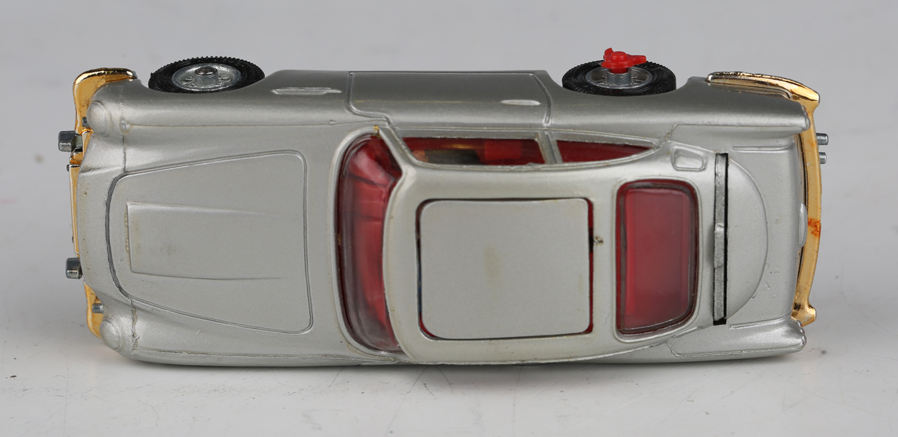 A Corgi Toys No. 270 The New James Bond Aston Martin, silver, with revolving number plates, tyre- - Image 4 of 11