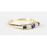 A gold, sapphire and diamond five stone ring, mounted with three circular cut sapphires