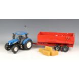 A Britains Big Farm radio control New Holland T6070 tractor and a bulk tipping trailer, both