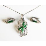 A white gold, jade and diamond pendant brooch, unmarked, weight 8.8g, length 5cm, with a white