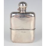 An Edwardian silver mounted cut glass hip flask with screw hinged lid and detachable cup,