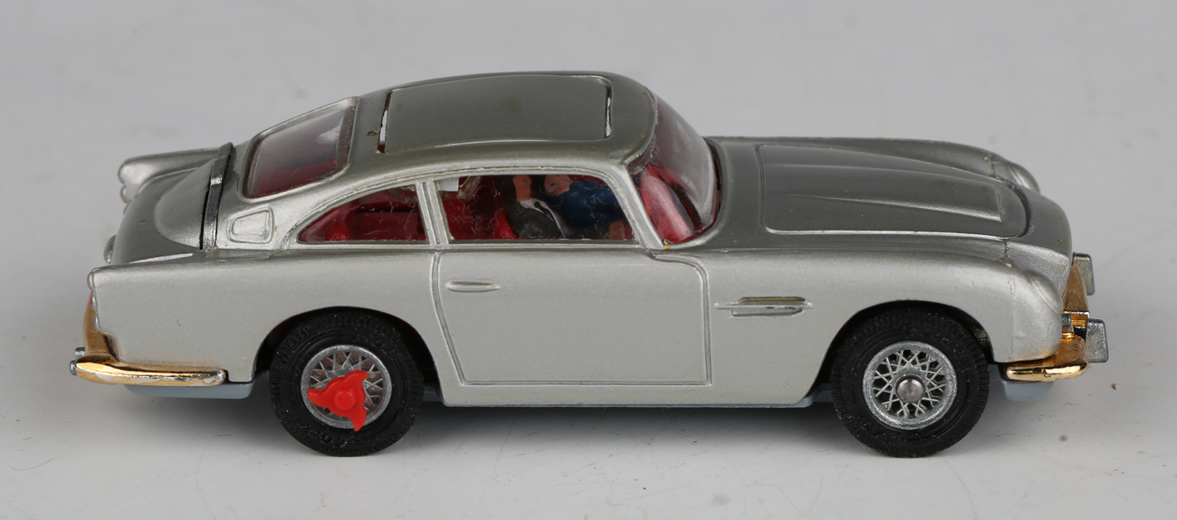 A Corgi Toys No. 270 The New James Bond Aston Martin, silver, with revolving number plates, tyre- - Image 7 of 11