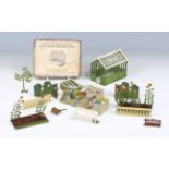 A Britains No. 053 span roof greenhouse, complete with staging and six trays of plants, boxed,