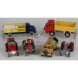 A collection of diecast vehicles and accessories, including a Dinky Toys No. 323 triple gang