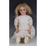 An Alt, Beck & Gottschalk bisque head doll, impressed '2 1/2', with blonde wig, pierced ears,