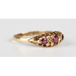 An Edwardian 18ct gold, ruby and diamond ring, mounted with three rubies and two rose cut