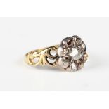 An early 19th century gold, silver and diamond cluster ring, mounted with the principal rose cut
