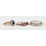 A 9ct gold and amethyst five stone ring, mounted with a row of graduated circular cut amethysts,