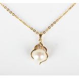 A gold, cultured pearl and diamond pendant, detailed '585 14K', length 1.9cm, with a gold neckchain,