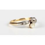 A French gold, diamond and cultured pearl ring, mounted with the principal cushion cut diamond and