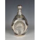 A Haig's whisky silver mounted clear glass dimple decanter and stopper, the three dimpled sides with