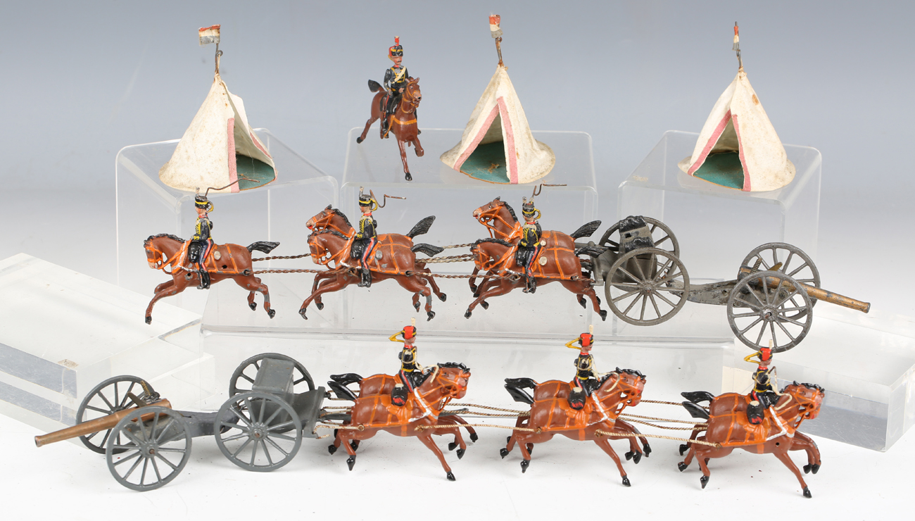 Four Britains lead horse-drawn field guns, a horse-drawn RAMC wagon, tents, two boxes and a box