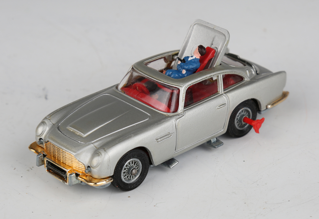 A Corgi Toys No. 270 The New James Bond Aston Martin, silver, with revolving number plates, tyre- - Image 11 of 11