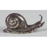 An early 20th century silver novelty box, modelled in the form of a snail with hinged shell,